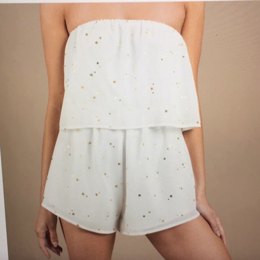 white romper with gold stars